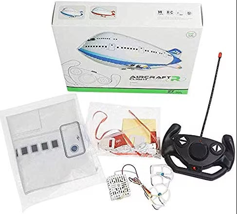 Balloon plane set with a handheld remote control, folded balloon material and assembly components