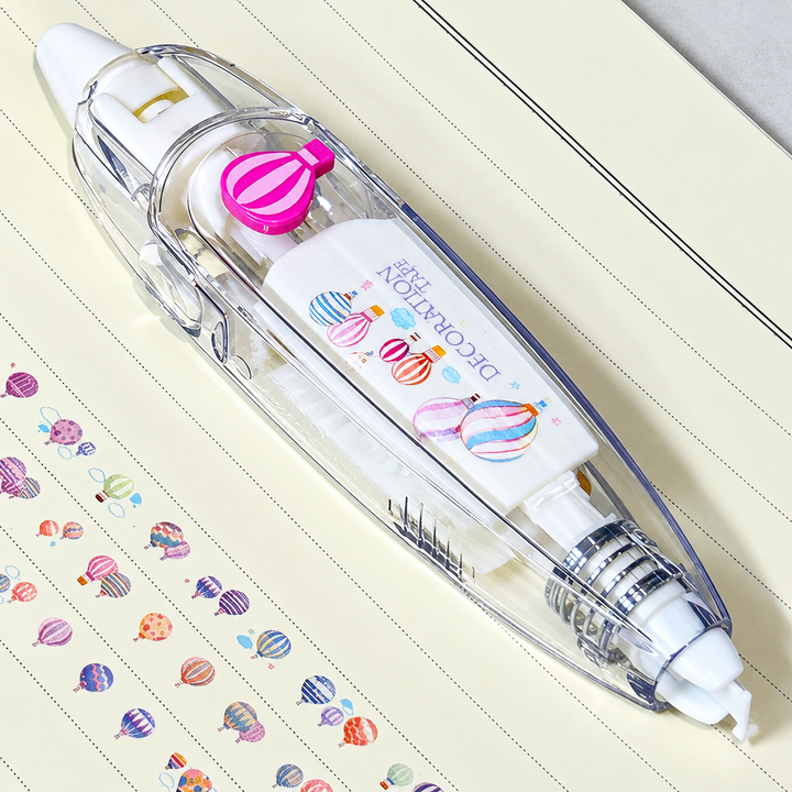Clear decorative tape dispenser with a balloon detail beside rows of colorful balloon motifs.