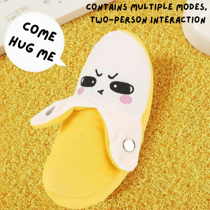 Yellow and white banana-shaped plush piano with round touch pads on its peel flaps
