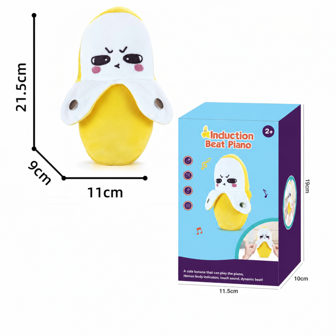 Banana plush piano beside its box, measuring 21.5 cm tall, 11 cm wide, and 9 cm deep