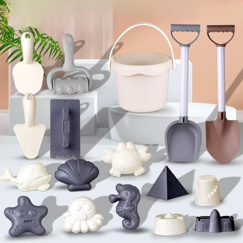 Beach bucket, two long shovels, hand tools, and sea-creature and castle molds