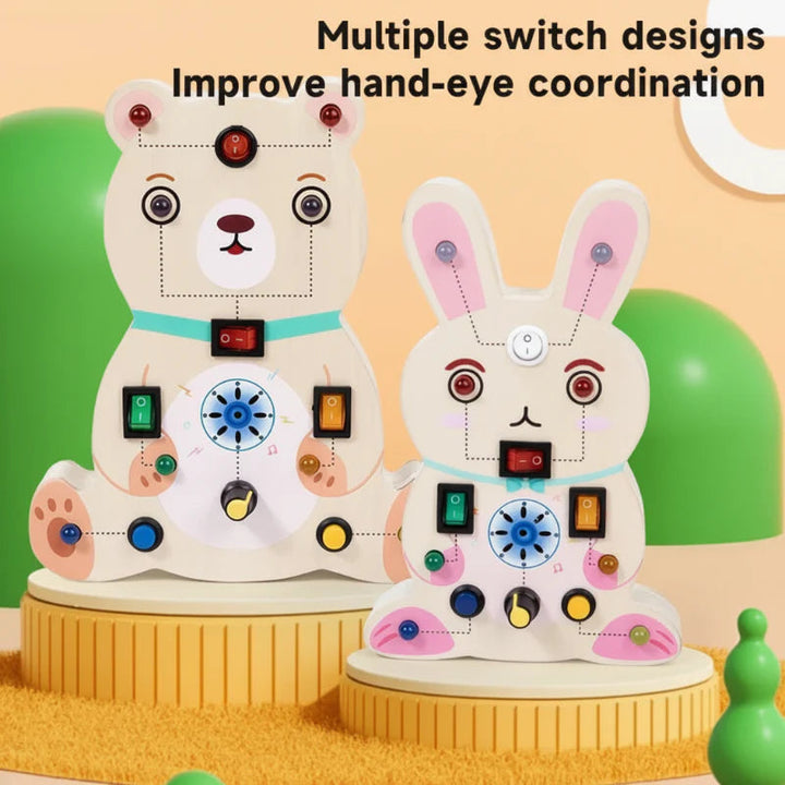 Bear and rabbit wooden activity boards with assorted switches, buttons, and rotary knobs
