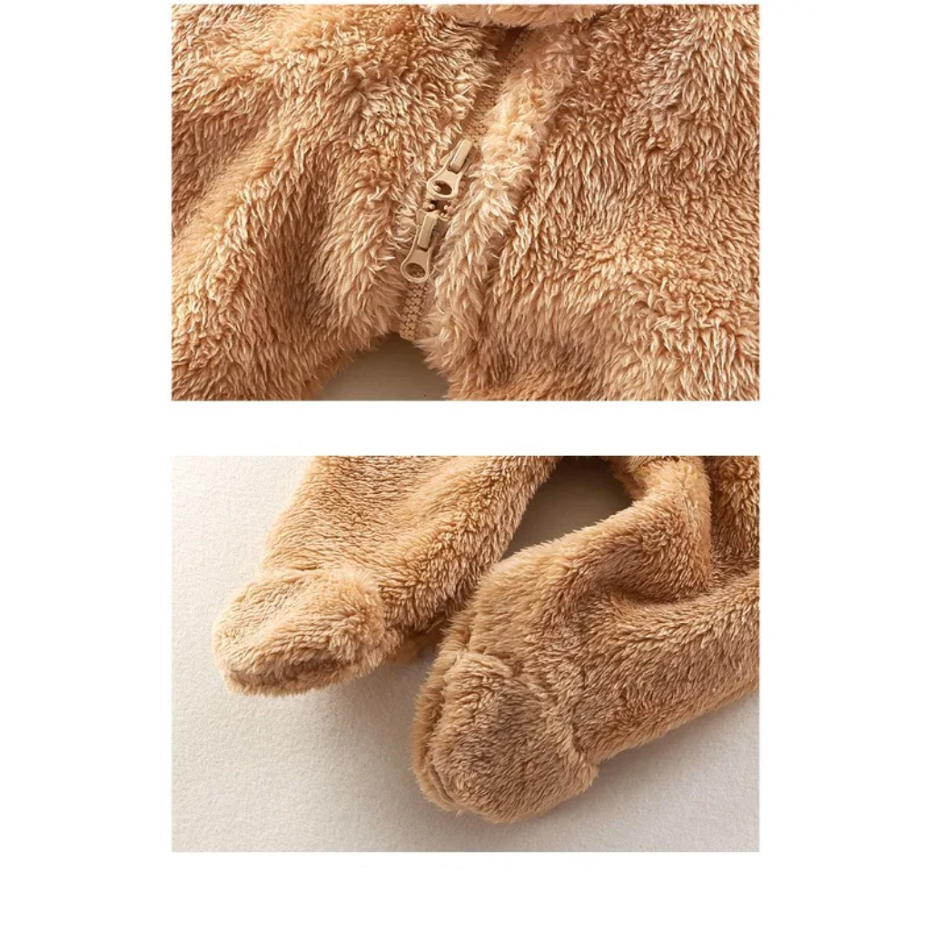Bear baby onesie details showing the front zipper and covered plush feet.