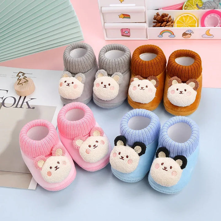 Bear baby slippers in pink, blue, gray, and brown with knitted ankle collars