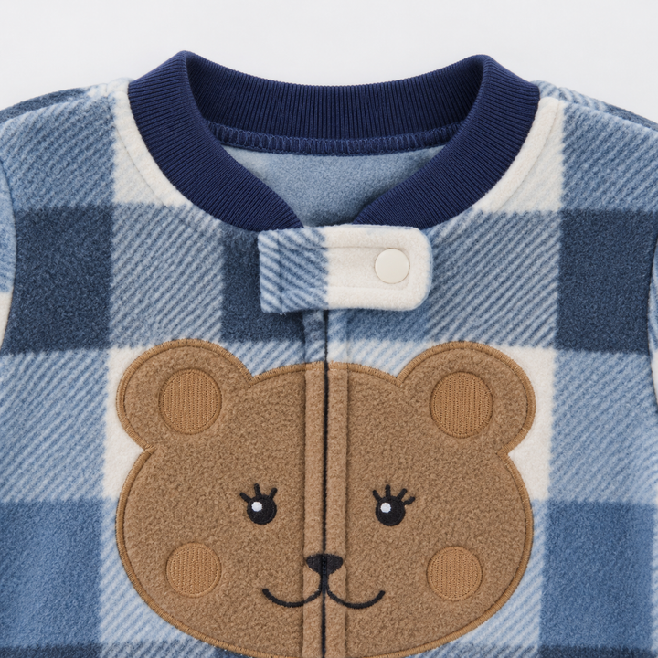 Bear chest design and round neckline on a blue check fleece baby jumpsuit