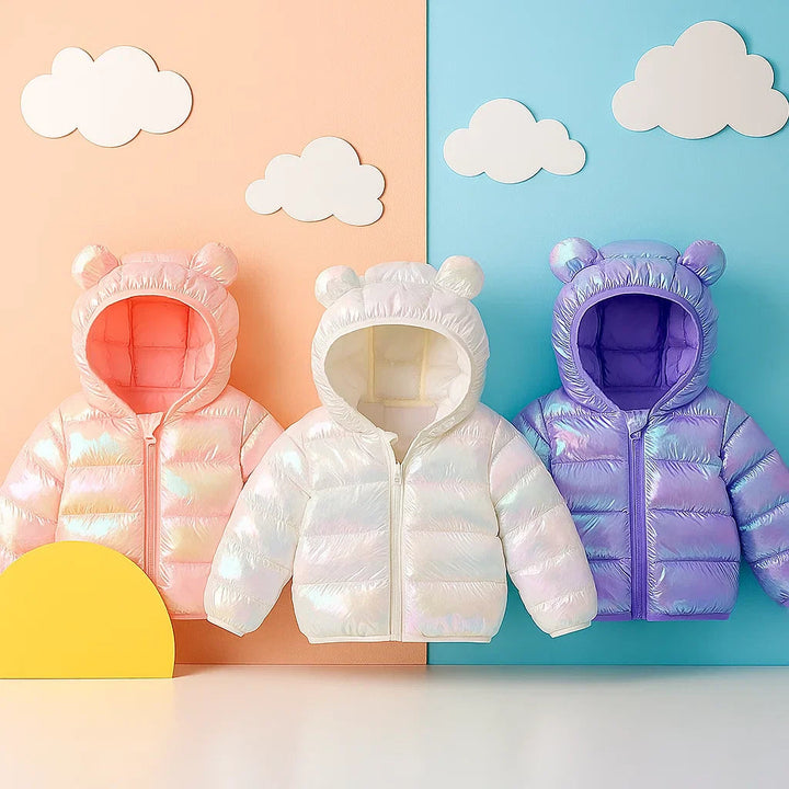 Pink, white, and purple bear-ear puffer jackets displayed together