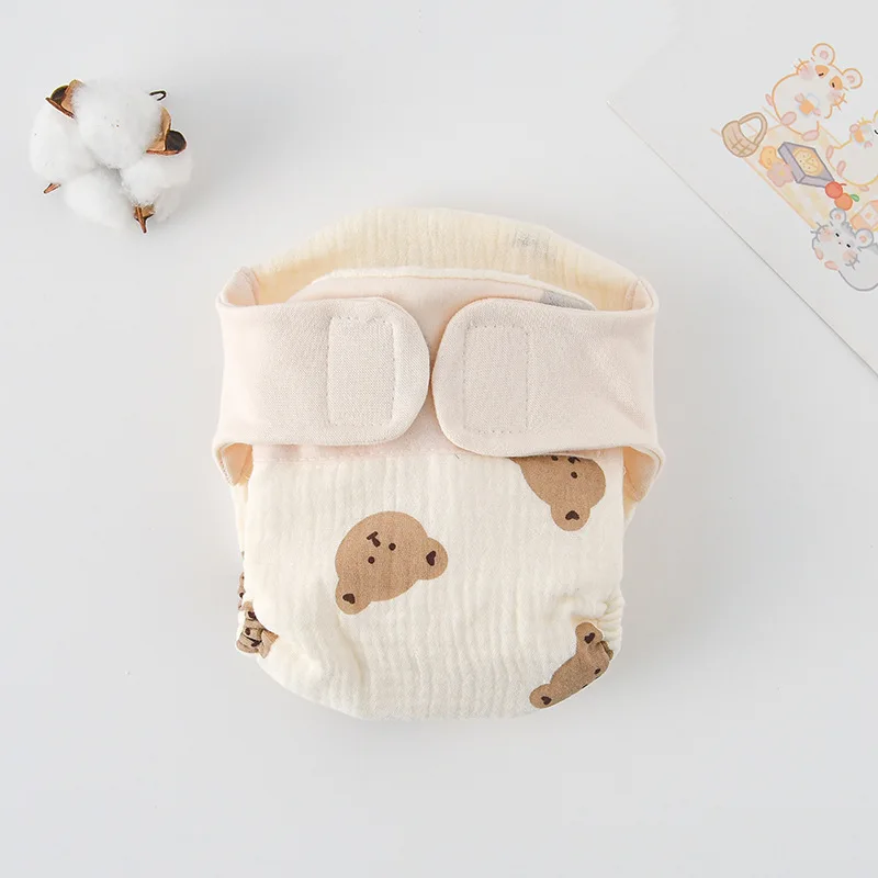 Bear-face print cloth diaper with a wide cream hook-and-loop waistband