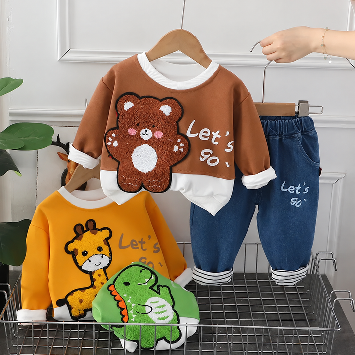 Brown bear outfit displayed alongside yellow giraffe and green dinosaur sweatshirt designs
