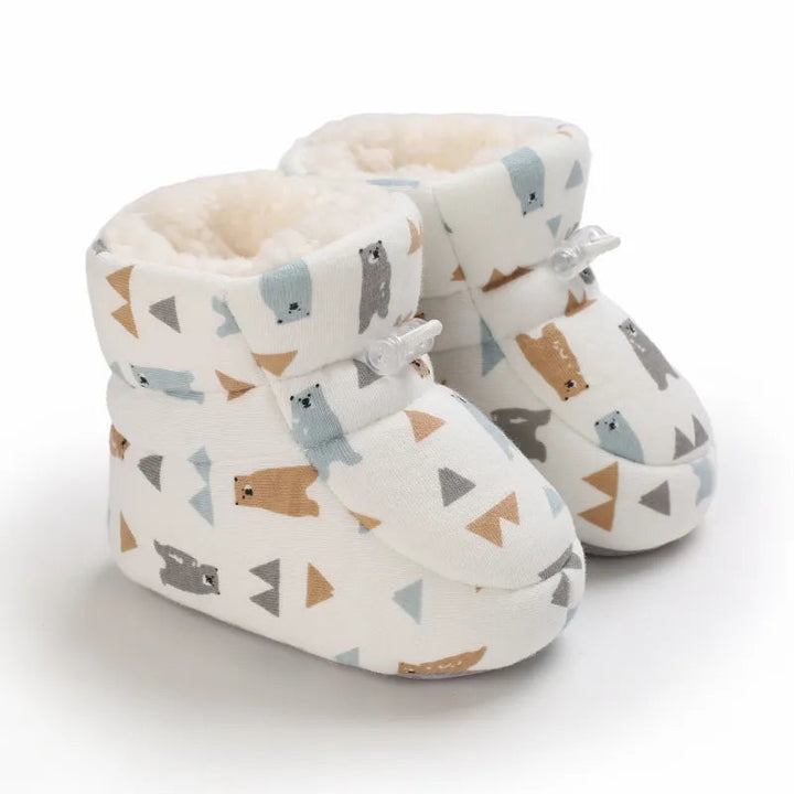 Cream bear-print baby slippers with soft lining and ankle fastenings