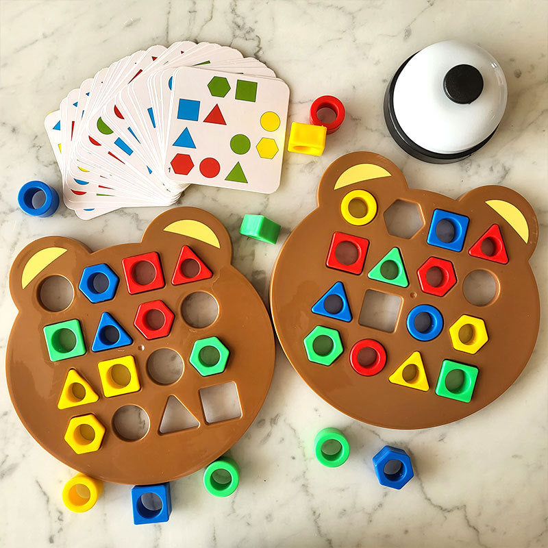 Bear-shaped puzzle boards with colorful pieces, pattern cards, and a tabletop bell
