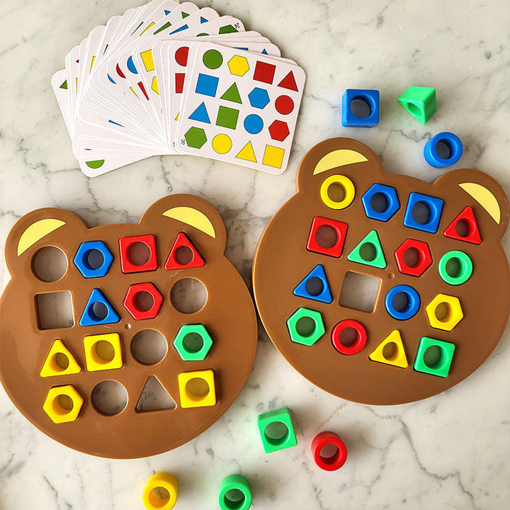 Two bear-shaped boards with colored shape pieces and a spread of pattern cards