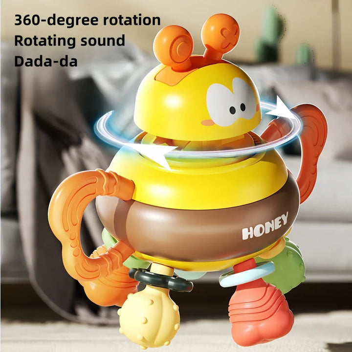Bee rattle with a rotation graphic around its yellow top