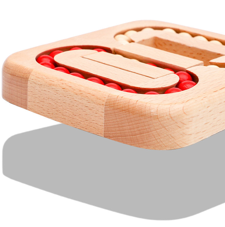 Close-up of the beech wood puzzle frame and red and beige bead tracks.