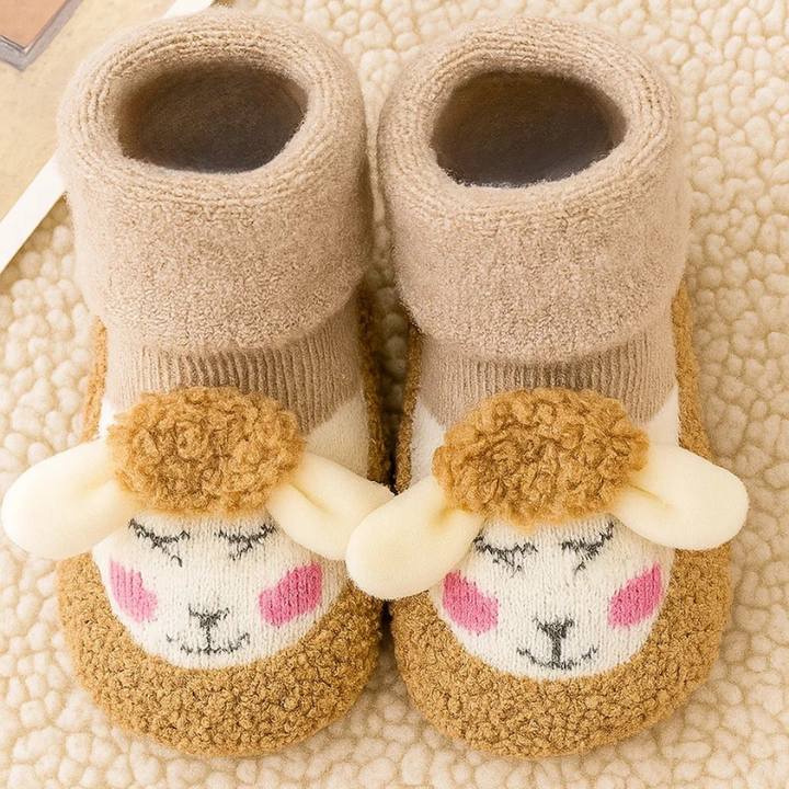 Beige baby socks with golden-brown toes, cream animal faces, and plush fold-over cuffs
