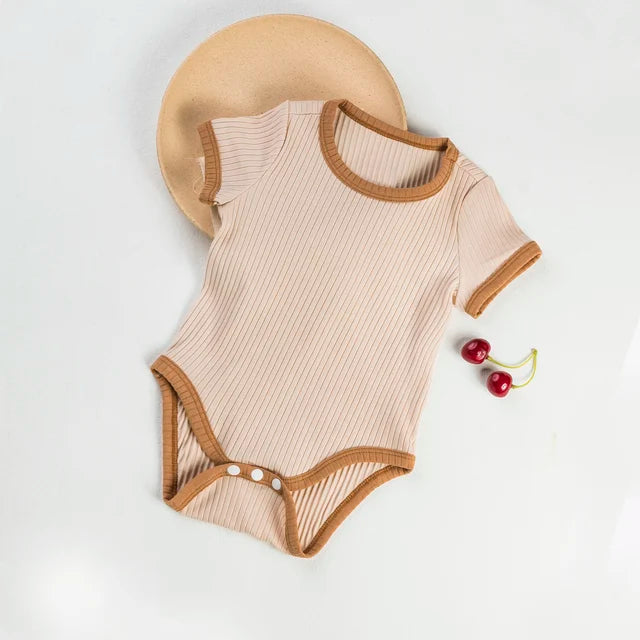 Beige ribbed baby romper with brown neckline, sleeve edges, and leg trim