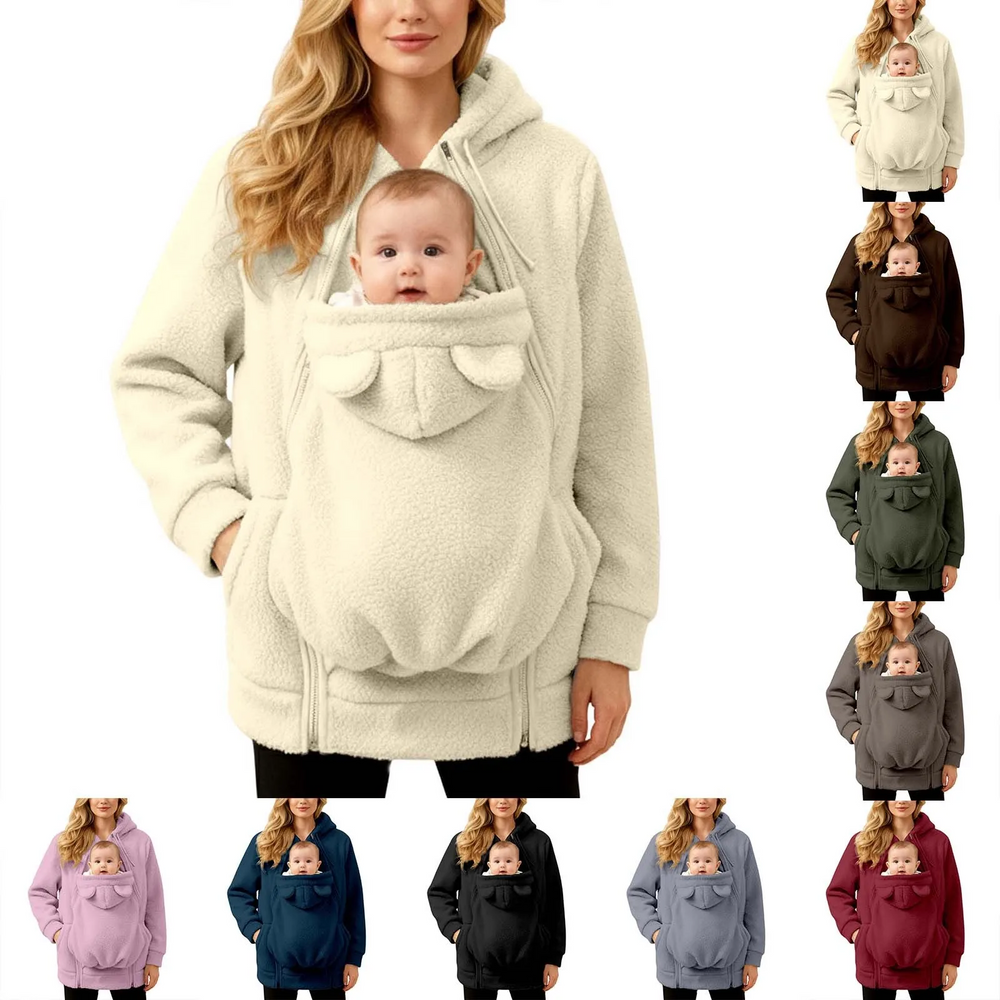Woman wearing a beige babywearing jacket with a baby, alongside other color options