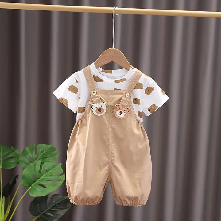 Beige bear-detail overall-style pants with a white bear-print T-shirt and gathered leg openings