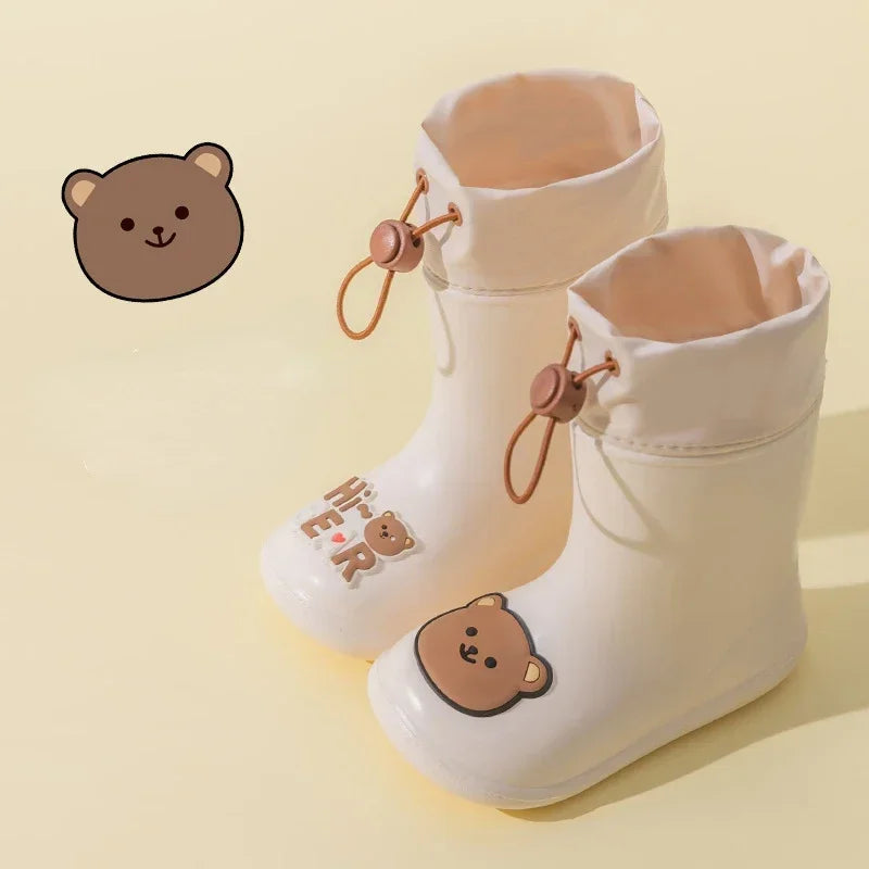 Beige rain boots with bear decorations and adjustable drawstring cuffs