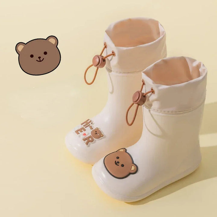 Beige rain boots with bear decorations and adjustable drawstring cuffs