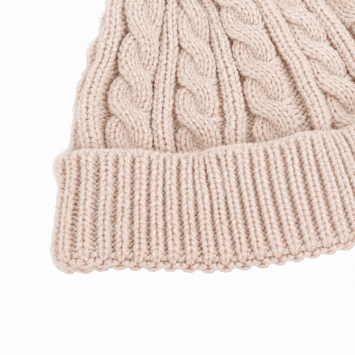 Close-up of beige cable stitching and the hat&