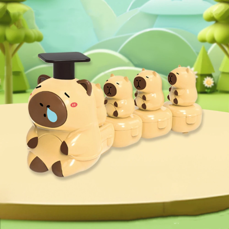 Beige capybara toy train with a black press-down top and smaller capybaras on trailing carriages