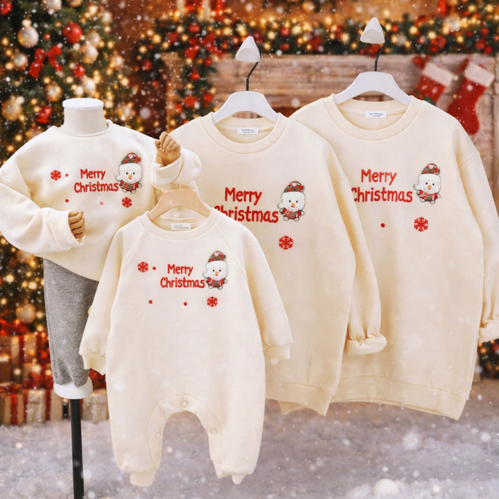 Beige Santa-print romper and matching Christmas sweaters displayed together