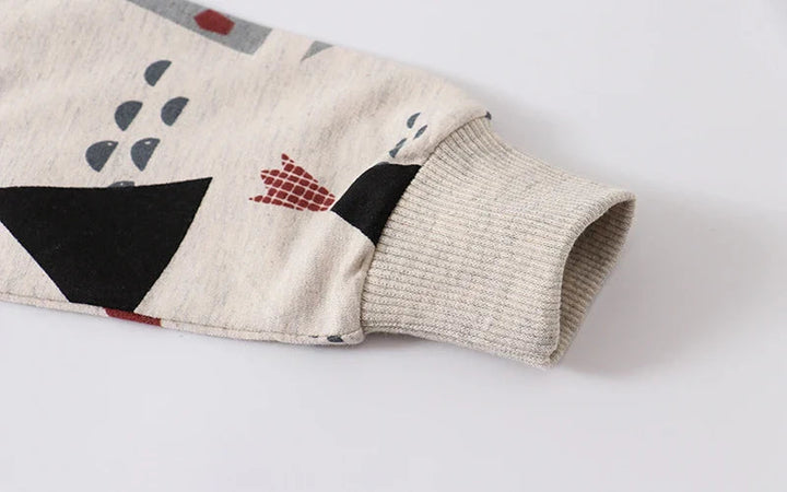 Ribbed sleeve cuff and geometric print on a beige cotton sweatshirt