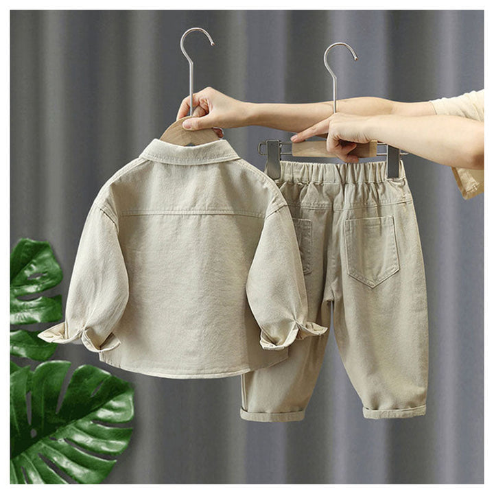 Back view of the beige jacket and matching pants on wooden hangers