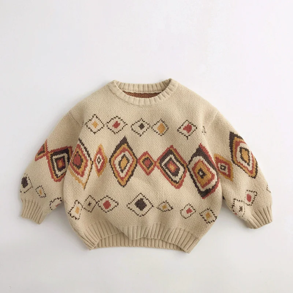 Beige kids' knit sweater with red, yellow, and brown diamond patterns and ribbed edges