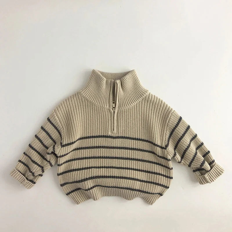 Beige kids' zip-neck sweater with dark horizontal stripes and ribbed cuffs