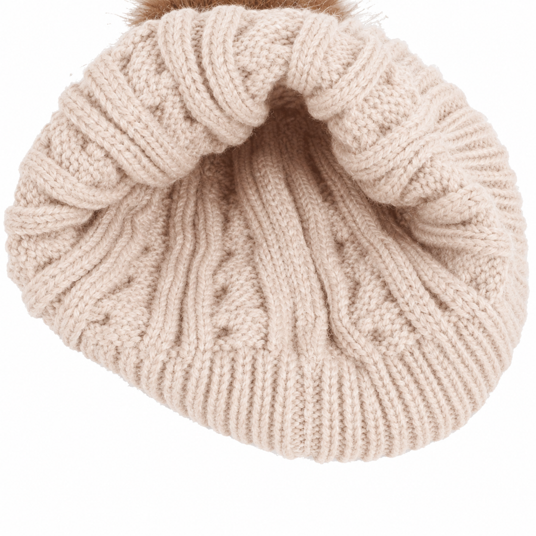 Beige knit hat viewed from the opening, showing its ribbed edge