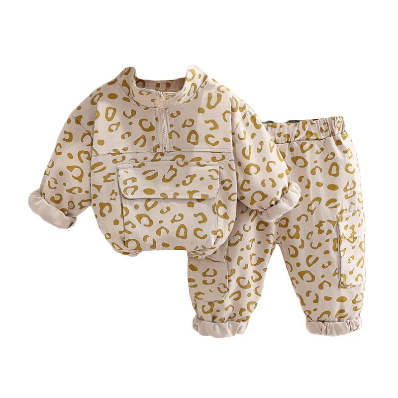 Beige leopard print pullover and pants shown together against a white background.