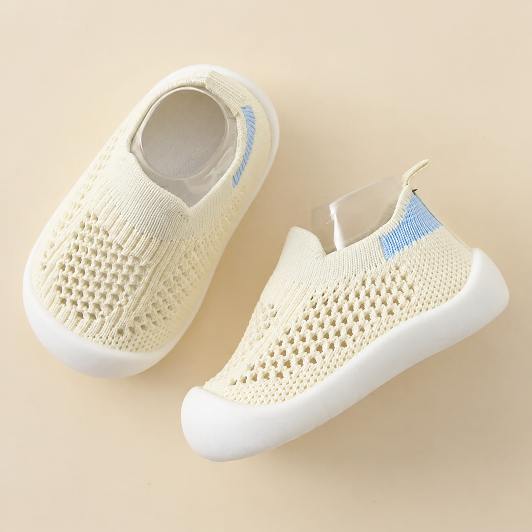 Beige mesh slip-on shoes with white soles and heel pull loops