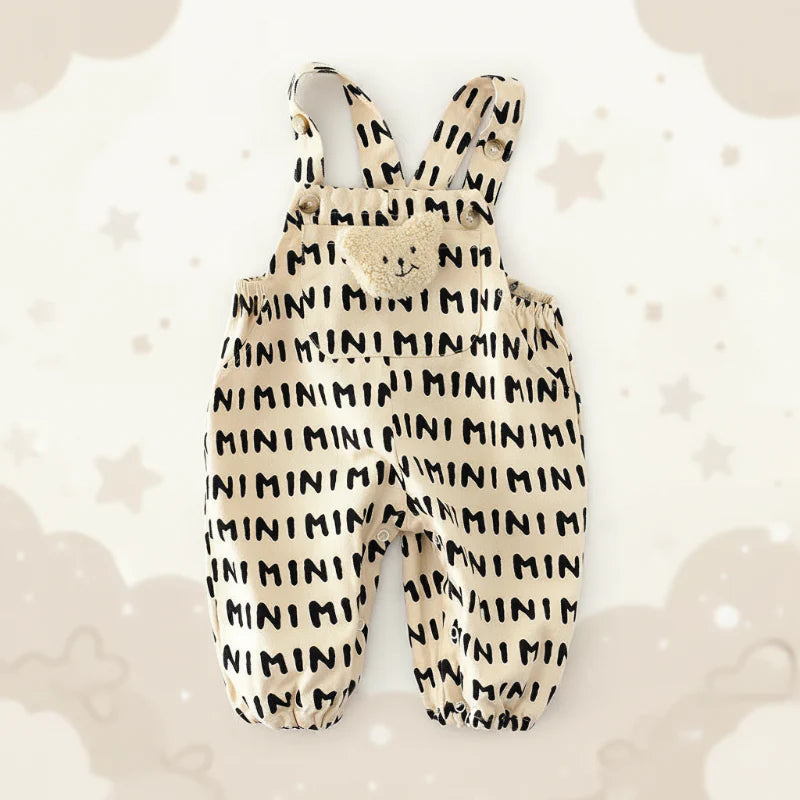 Beige MINI-print overall romper with a teddy bib detail and gathered ankle cuffs