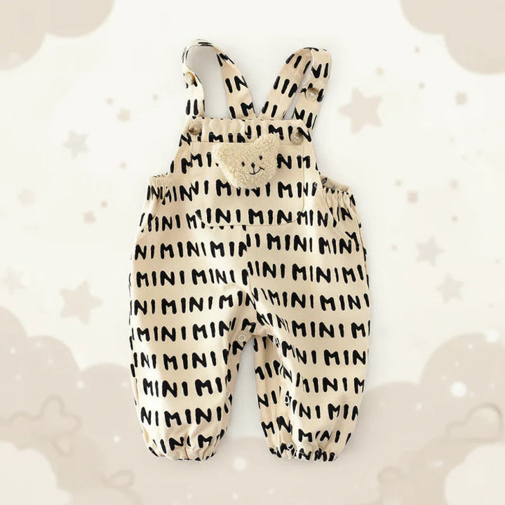 Beige MINI-print overall romper with a teddy bib detail and gathered ankle cuffs