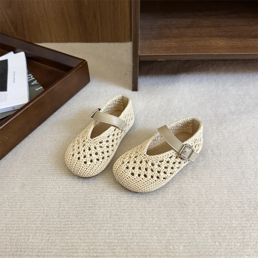 Beige Mary Jane flats with rounded toes, openwork uppers and matching straps