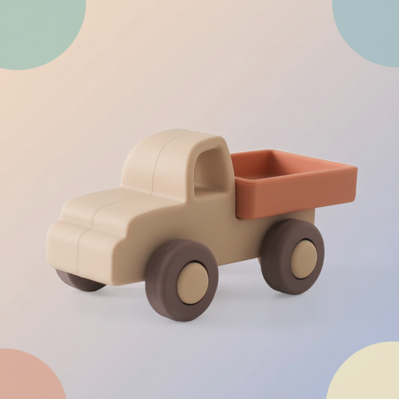 Beige pickup truck toy with a rust-colored bed and brown wheels
