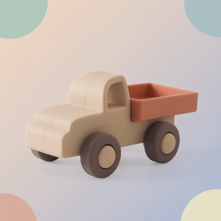 Beige pickup truck toy with a rust-colored bed and brown wheels