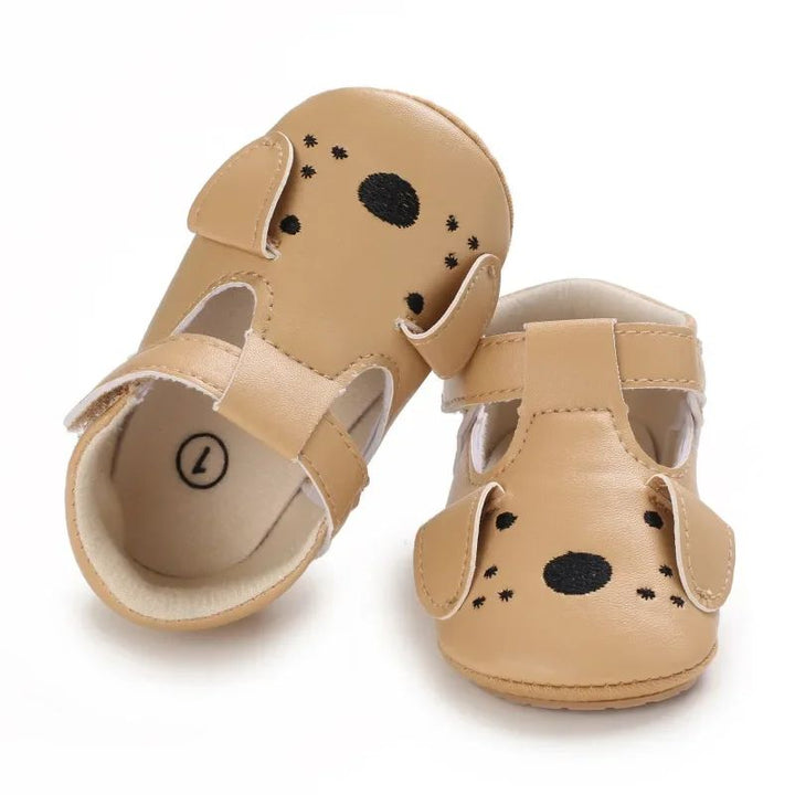 Beige puppy-face baby shoes with floppy ears and dotted muzzle details