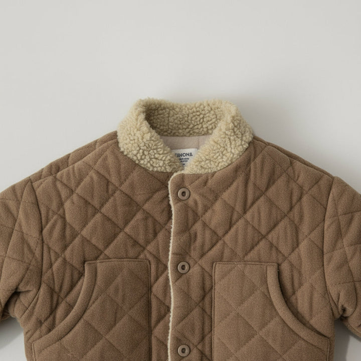 Beige quilted coat showing its sherpa collar, front buttons, and two pockets