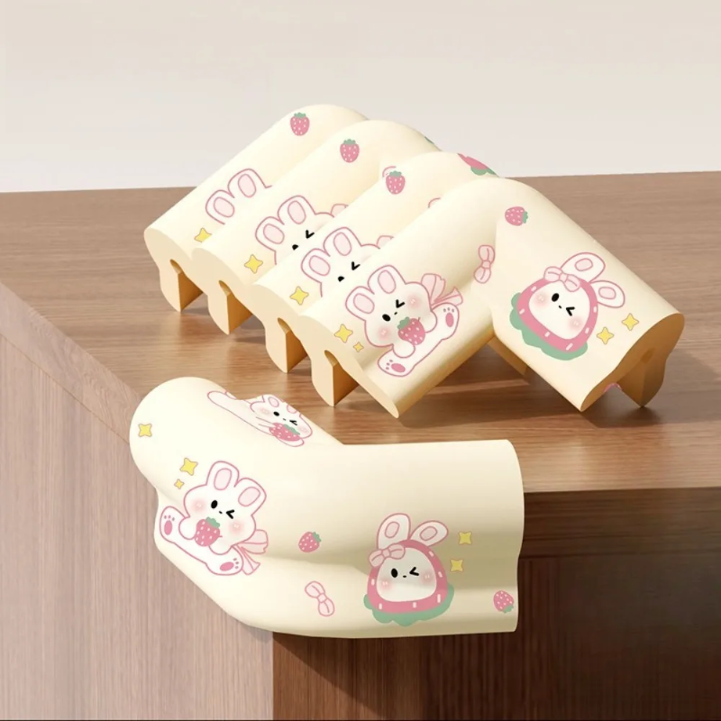 Five beige rabbit-print foam corner covers, with one fitted to a wooden furniture corner.