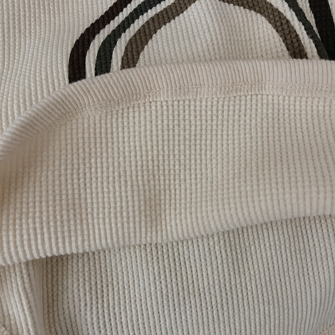 Close-up of the beige T-shirt&