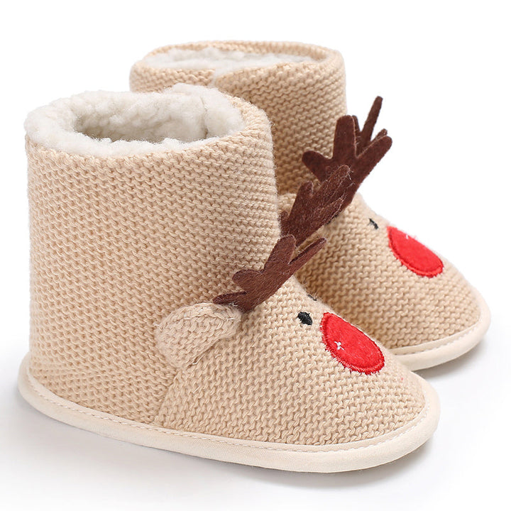 Beige knit-look baby boots with reindeer antlers, red noses and white soles