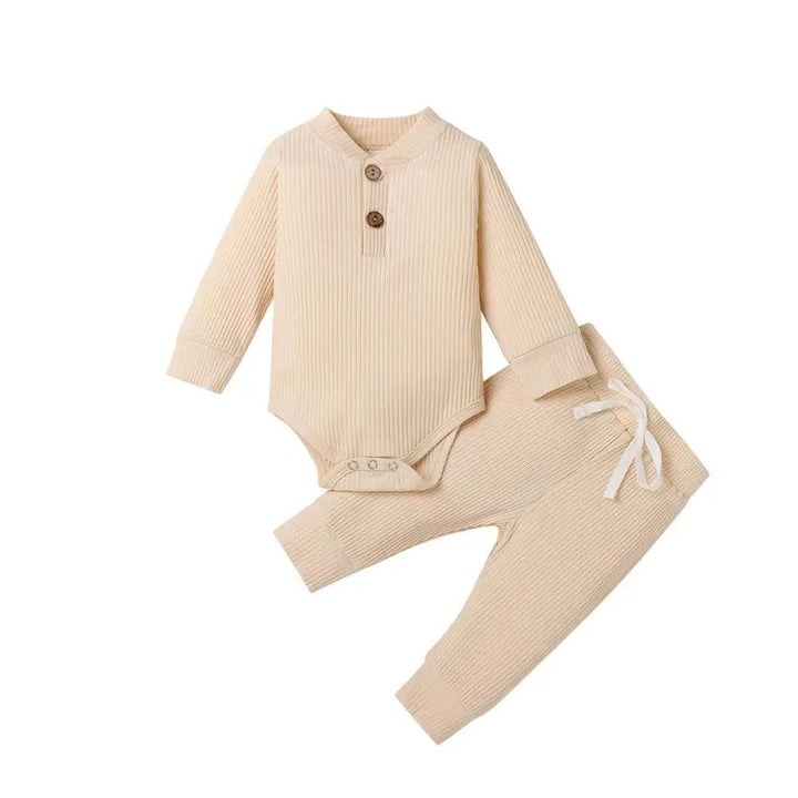 Beige ribbed long-sleeve baby bodysuit and matching pants with neckline buttons