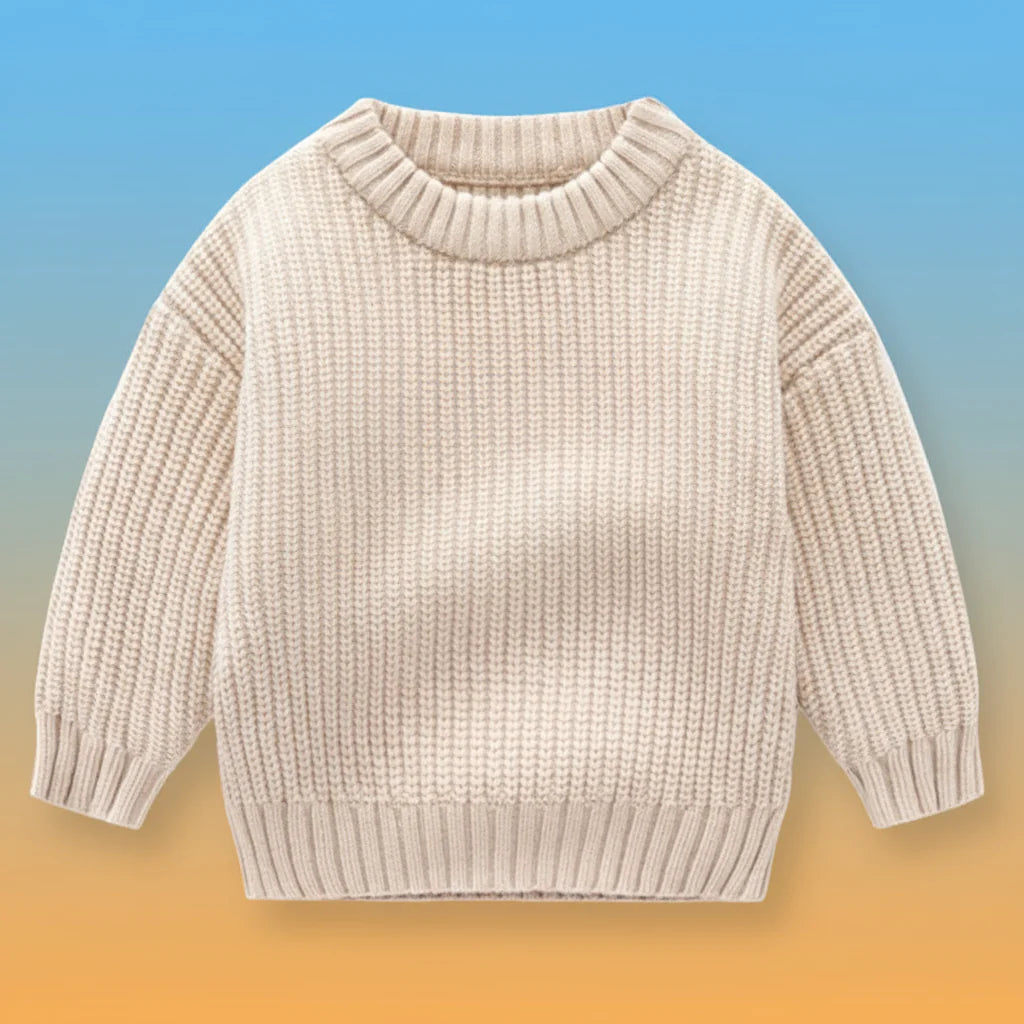 Beige knit sweater with long sleeves and ribbed neckline, cuffs, and hem.