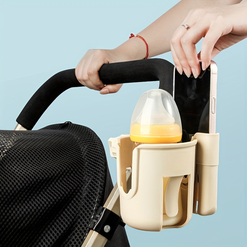 Beige stroller holder carrying a baby bottle and phone beside the handle.