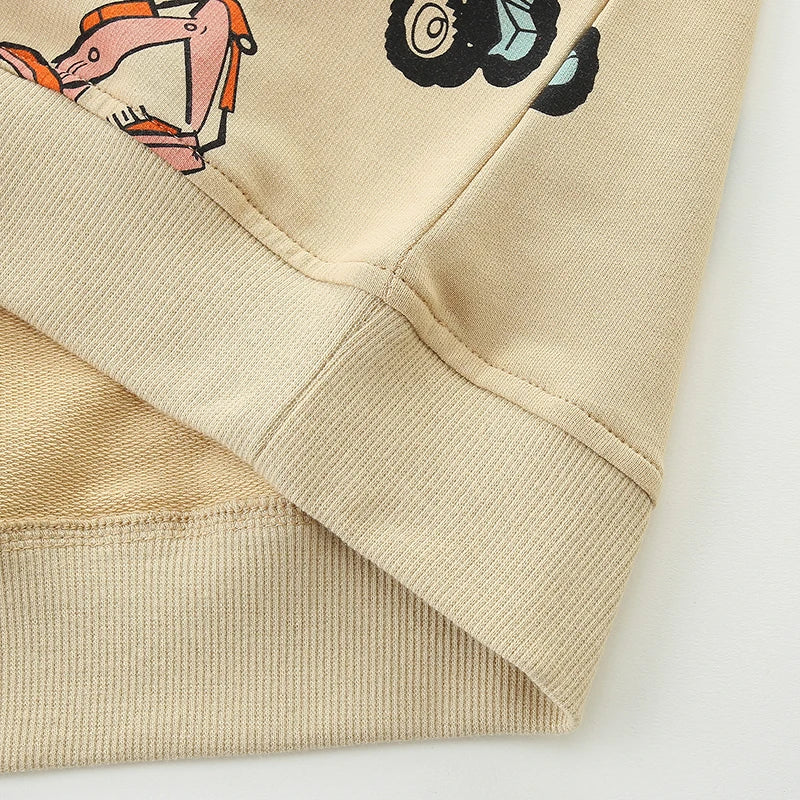 Close-up of the ribbed hem and sleeve cuff on the beige sweatshirt