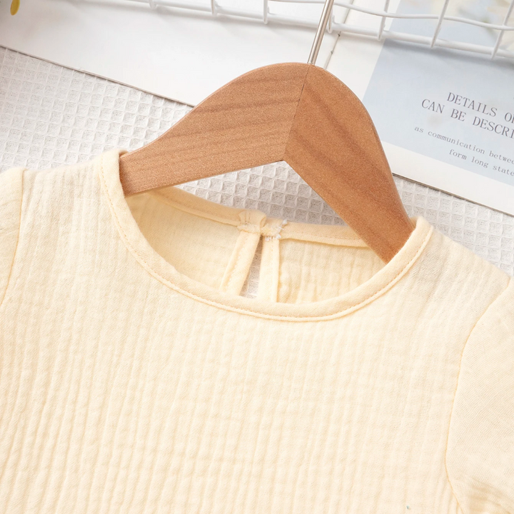 Close-up of the beige cotton top&