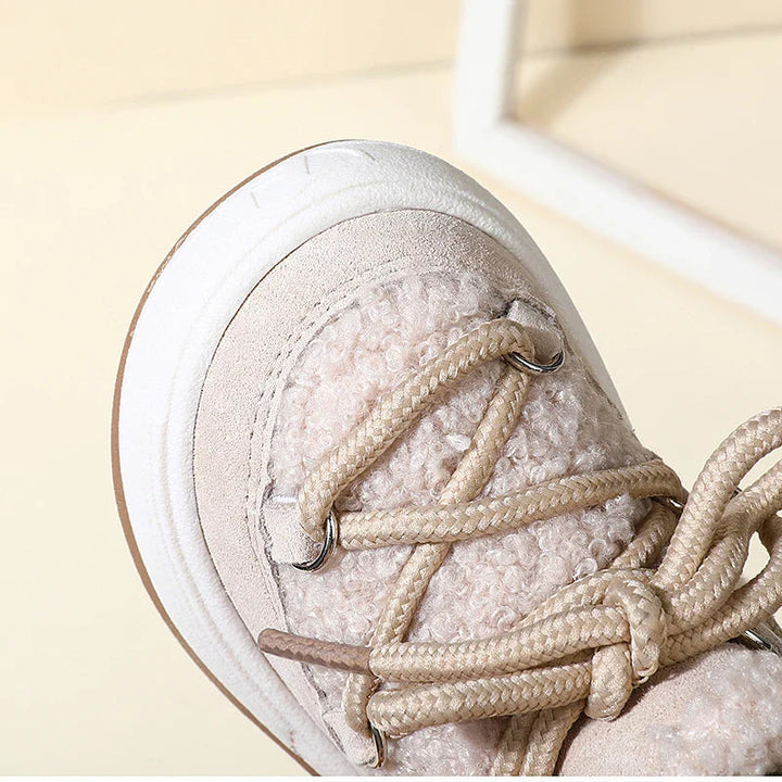 Close-up of a beige winter boot&