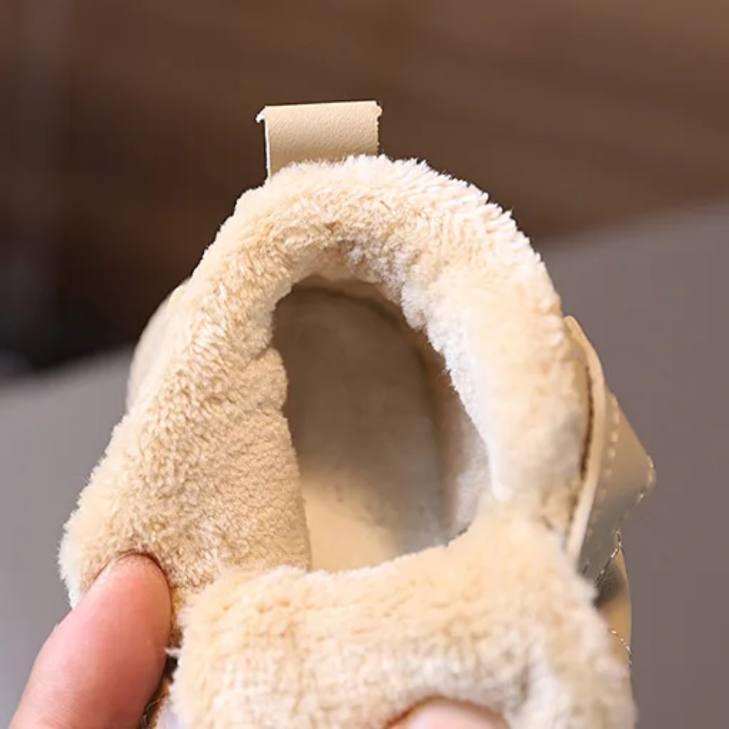 Close-up of the plush lining inside a beige winter boot